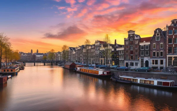 Amsterdam sunset city skyline at canal waterfront, Amsterdam, Netherlands,