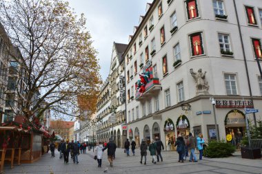Munich, Germany - November 26, 2017: Shopping street decorated for Christmas and Christmas market stands in old town Munich, Germany.