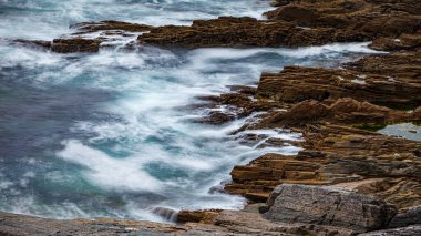 Waves at the cliffs at the coast of ireland