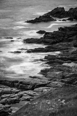 Waves at the cliffs at the coast of ireland