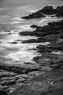 Waves at the cliffs at the coast of ireland