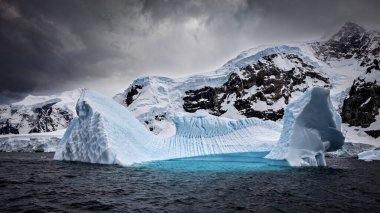 Glacier and Iceberg in the Antarctic Landscape clipart