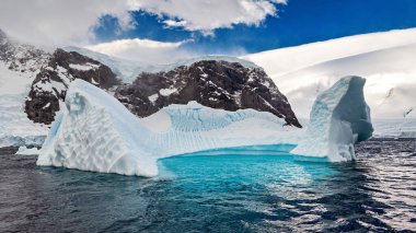 Glacier and Iceberg in the Antarctic Landscape clipart