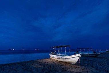 Boats at the beach of Trincomalee in Sri Lanka clipart