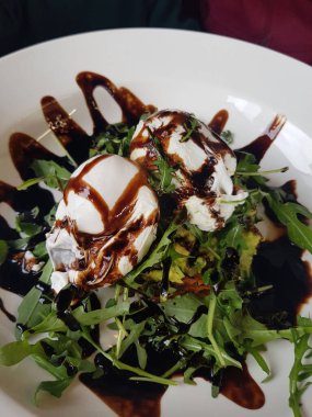 scrambled eggs with arugula. Hearty healthy breakfast