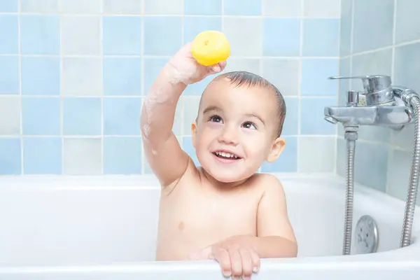 Smiling Toddler Shows Camera Rubber Ducky She Playing Bath Time — Stock Photo, Image