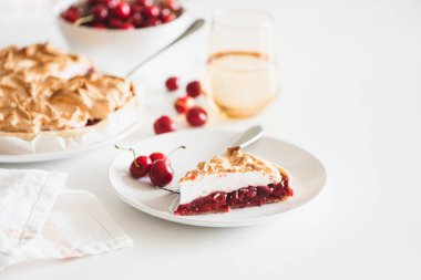 Plate with tasty cherry pie on white background. Top view. Front view