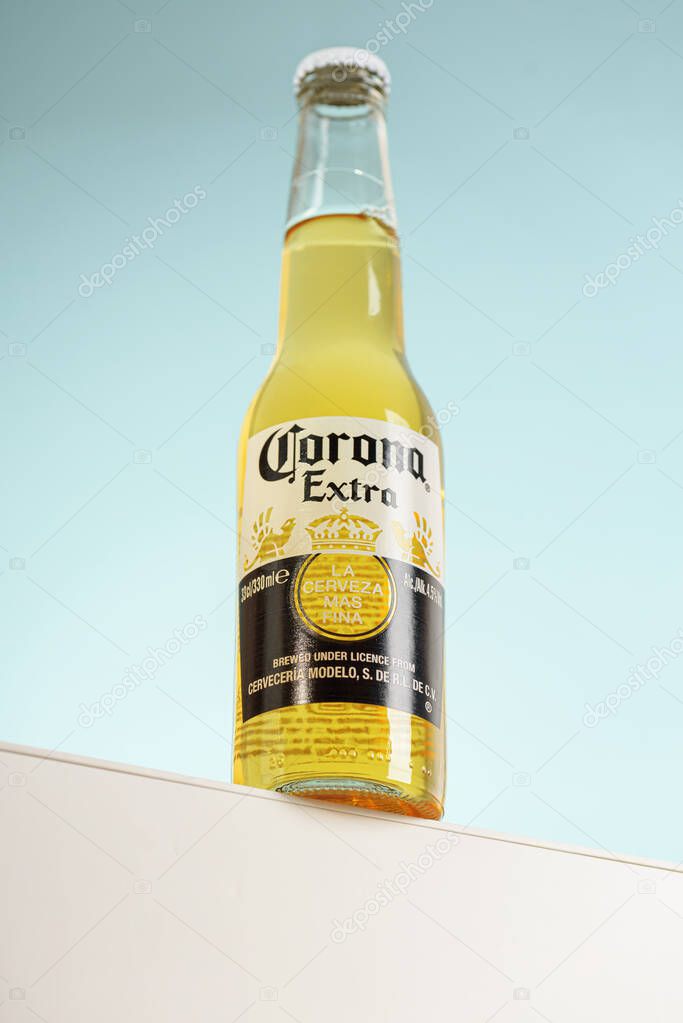 Lviv, Ukraine - April 21, 2025: Mexican Corona Extra beer glass bottle on podium