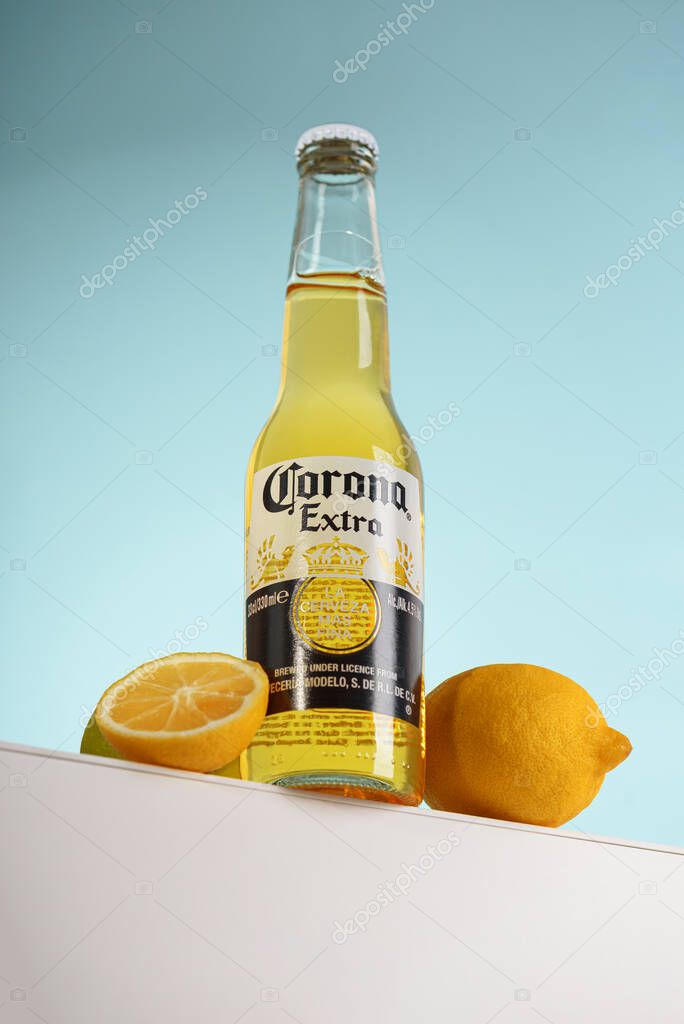 Lviv, Ukraine - April 21, 2025: Mexican Corona Extra beer glass bottle on podium