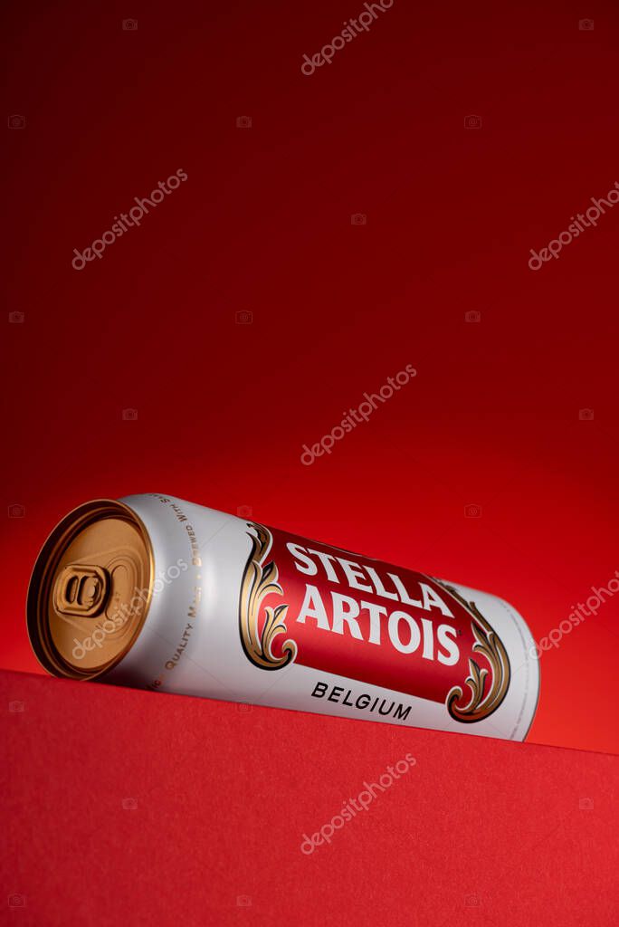 Lviv, Ukraine - May 15, 2025: Stella Artois lager beer in aluminum tin on red background