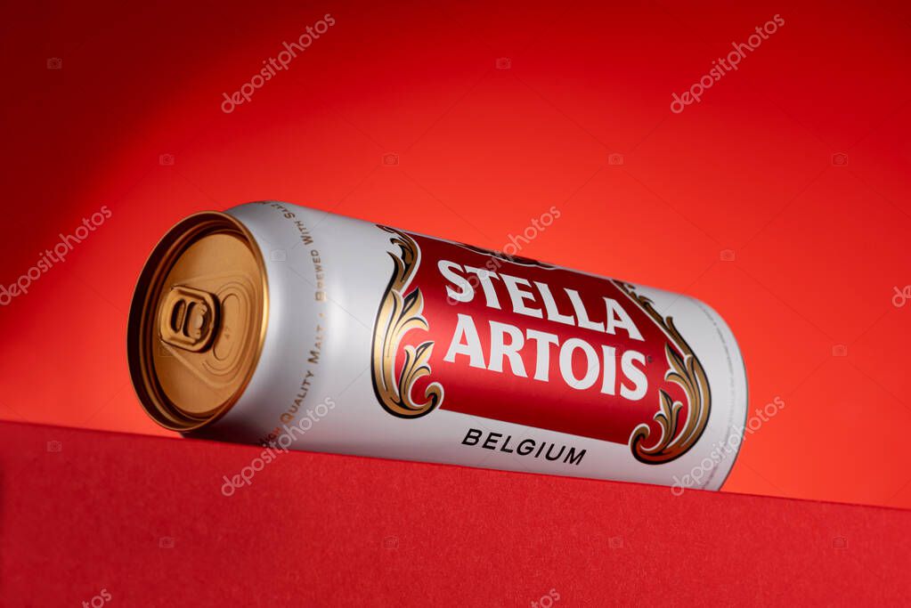 Lviv, Ukraine - May 15, 2025: Stella Artois lager beer in aluminum tin on red background