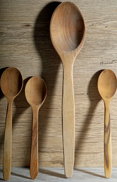 wooden spoons on wooden background