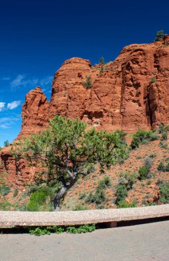 Red Bell Rock in the National Forest at Sedona, Arizona is a popular travel destination for visitors. clipart