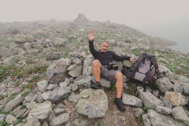 Hiker taking a break during mountain climbing