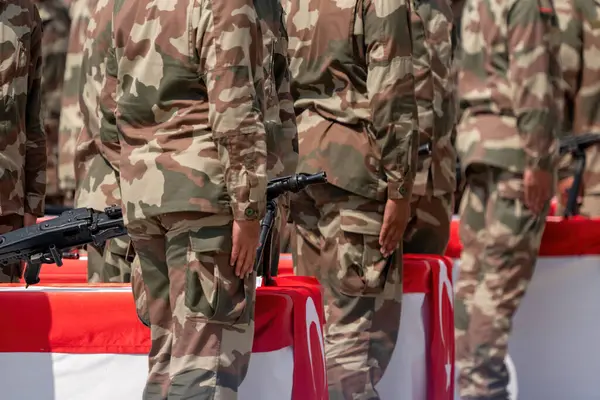 Turkish soldiers taking the oath at the military swearing-in ceremony.