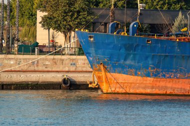 The rusted metal hull of a ship, small micro-organisms adhering to the bottom of the ship, Kekamoz.Barnacle clipart