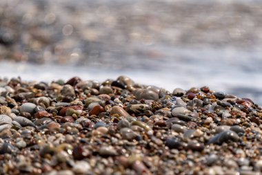 Wet pebbles by the sea