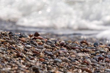 Wet pebbles by the sea