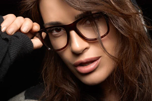 Close Young Woman Holding Her Eyeglasses While Looking Camera Cool — Stok fotoğraf