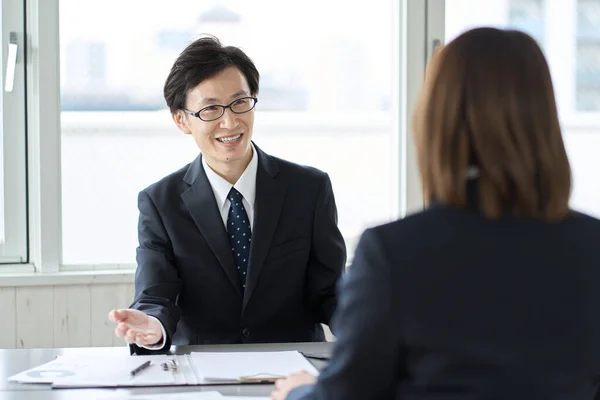 stock image Asian business people having a meeting in a conference room