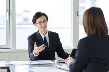 Asian business people having a meeting in a conference room