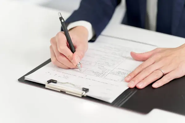 Businessman Filling Out Parental Leave Application Form — Stock Photo, Image