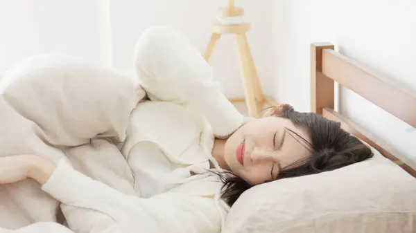 stock image Asian woman who can't sleep because of the heat