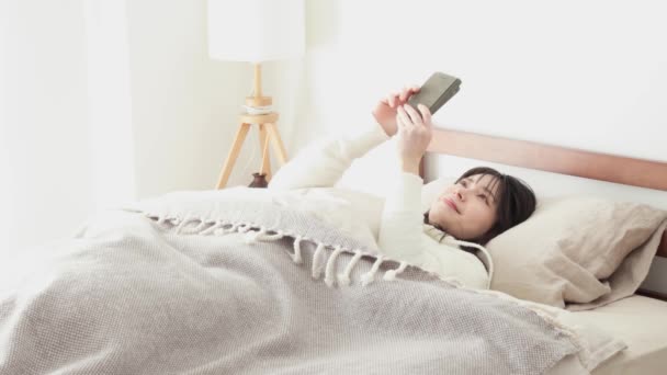 Asian Woman Looking Smartphone Waking — Stock Video