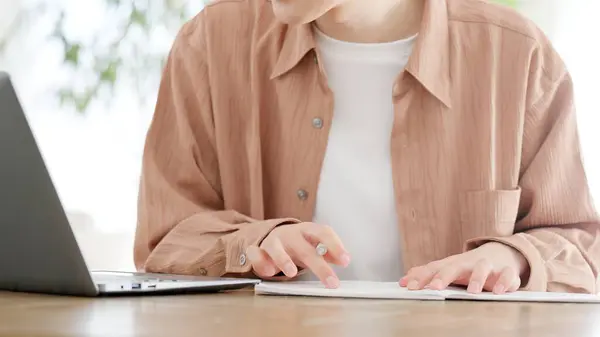 Stock image A man studying for a qualification at home