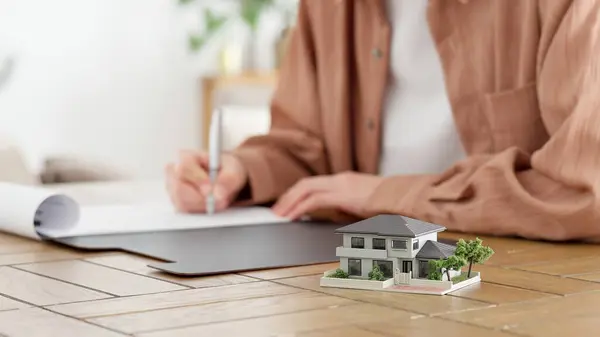 stock image Hands of a man signing a real estate contract