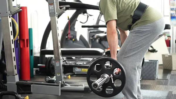 stock image Man working out his whole body with deadlifts