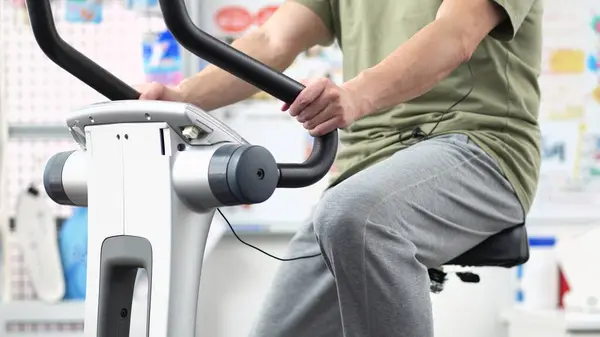 stock image Man training on an exercise bike