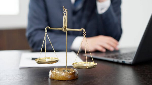 The hands of a businessman conducting a survey on a computer