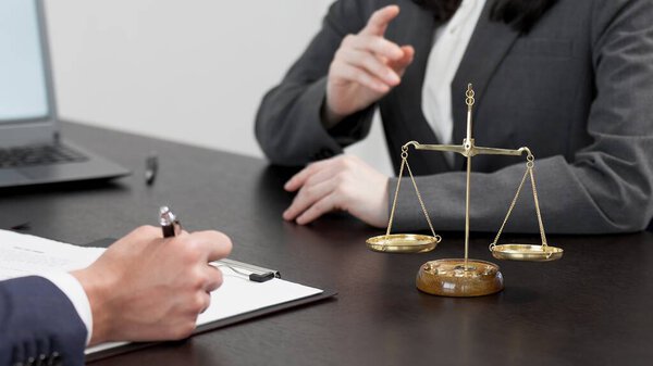 The hands of a lawyer receiving consultation on a problem