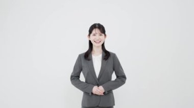 Asian business woman standing with a smile