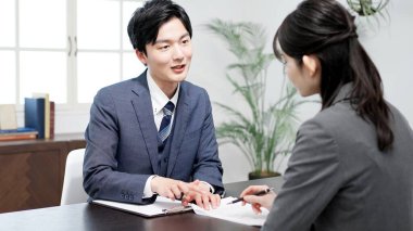 Asian lawyer explaining the contract clipart