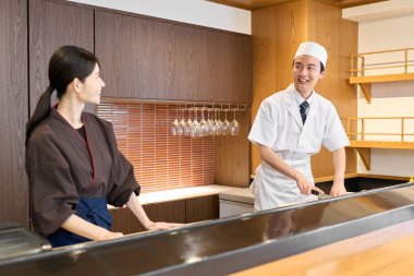 Employees at a Japanese restaurant working happily clipart