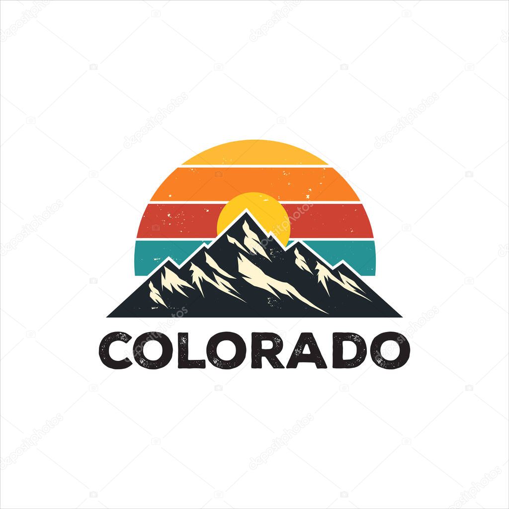 Colorado Mountain Logo with Sunrise. Vintage-style Colorado mountain logo design. A graphic design showcasing a retro sunset over a mountain range.