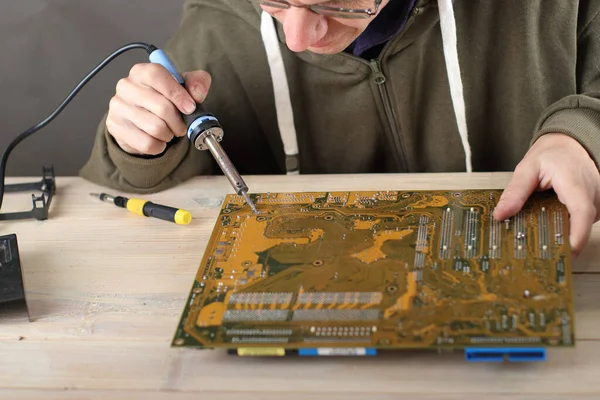 Soldering Computer Motherboard Person Table Gray Background — Stock Photo, Image