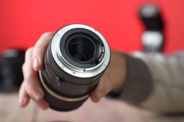 macro lens bayonet in close-up over table and pink background