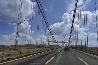 View from the car on the suspension bridge in Lisbon, Portugal.