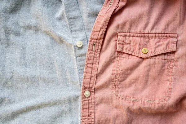 Duas Camisas Diferentes São Abotoadas Juntas Tecido Texturizado Fundo Rosa — Fotografia de Stock