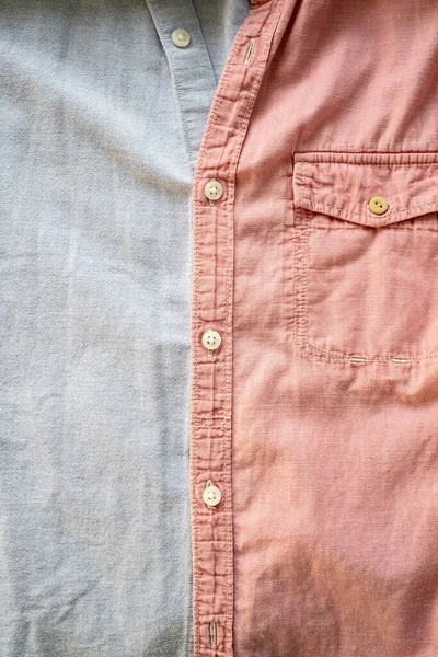 Duas Camisas Diferentes São Abotoadas Juntas Tecido Texturizado Fundo Rosa — Fotografia de Stock