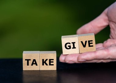  Cubes form the words give and take. Symbol for giving instead of taking something.