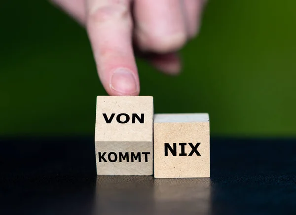 Wooden cubes form the German saying \'von nix kommt nix\' (If you do not work hard you will not see any results).