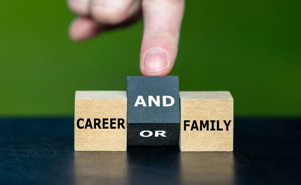 Symbol for combining career and family. Hand turns cube and changes the expression \'career or family\' to \'career and family\'.
