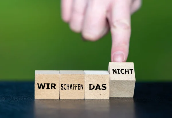Wooden cubes form the German expression \'wir schaffen das nicht\' (we can not do it). A political slogan used in Germany during the migration crisis.