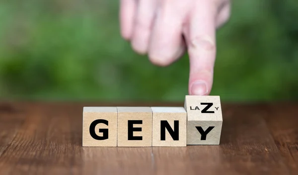 Symbol for a lazy life style of people from Generation Z. Hand turns cubes and changes the expression 'GEN Y' to 'GEN Z'.