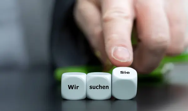 stock image Wooden cubes form the German expression 'wir wollen sie' (we want you).