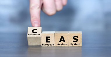 Cubes form the expression Common European Asylum System (CEAS). clipart